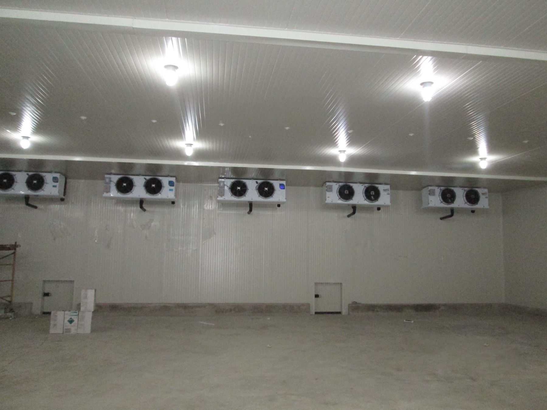 Frozen cold room interior with floor and drainage detail