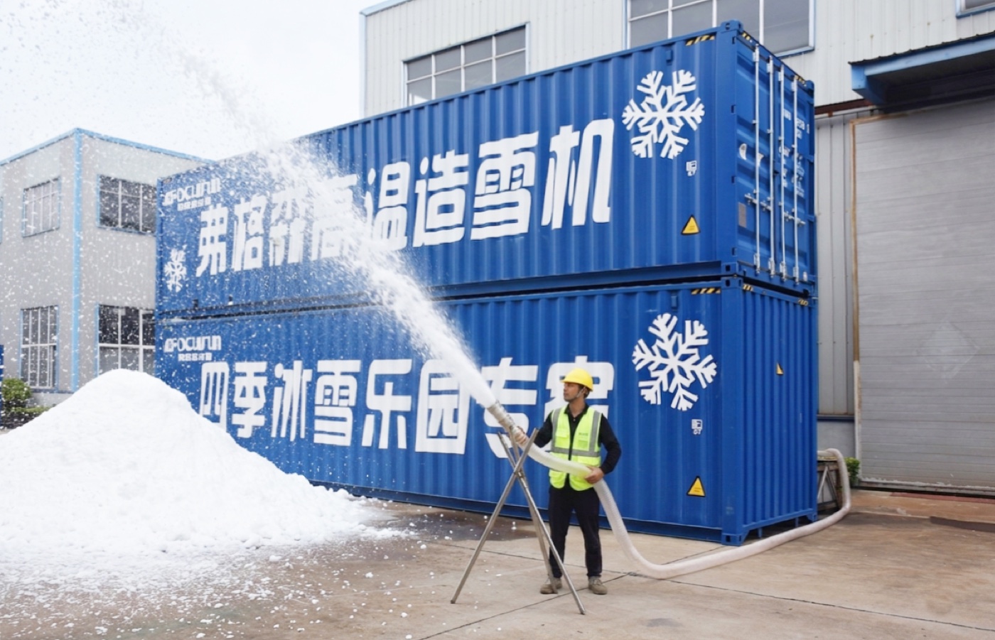 Containerized snowmaking system operating at an outdoor project site