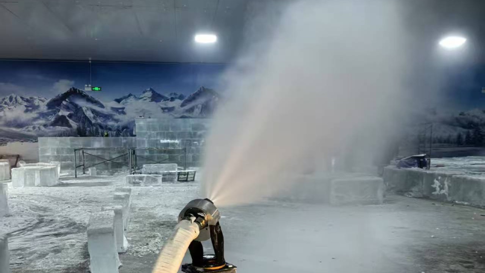Indoor snow venue with a falling snow effect and ice scenery