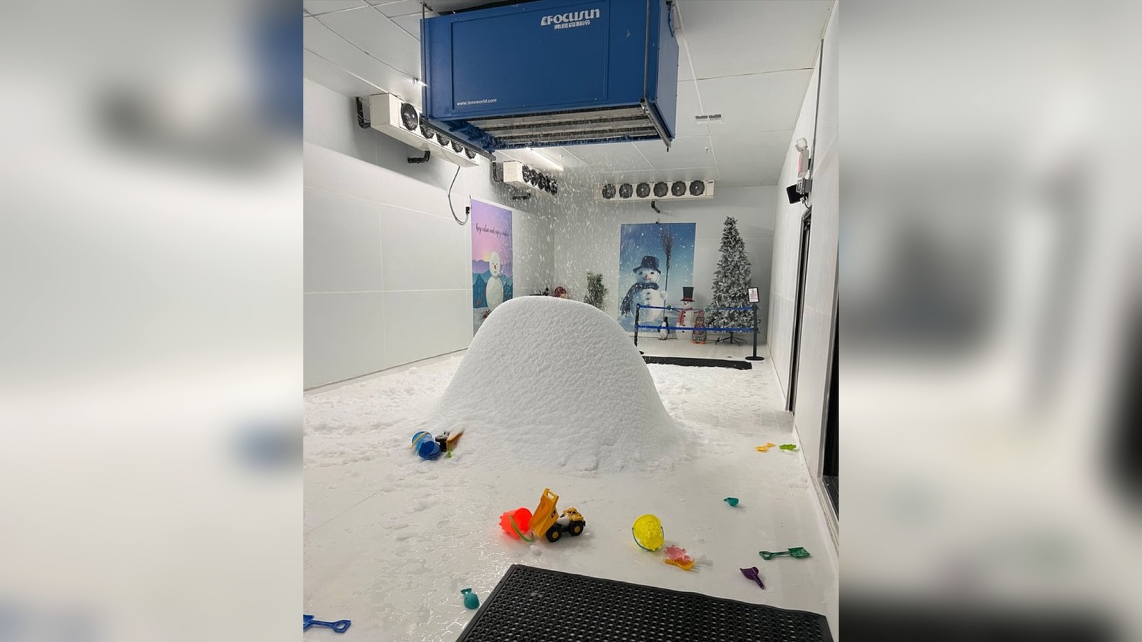 Indoor family snow play room with snowmaking equipment