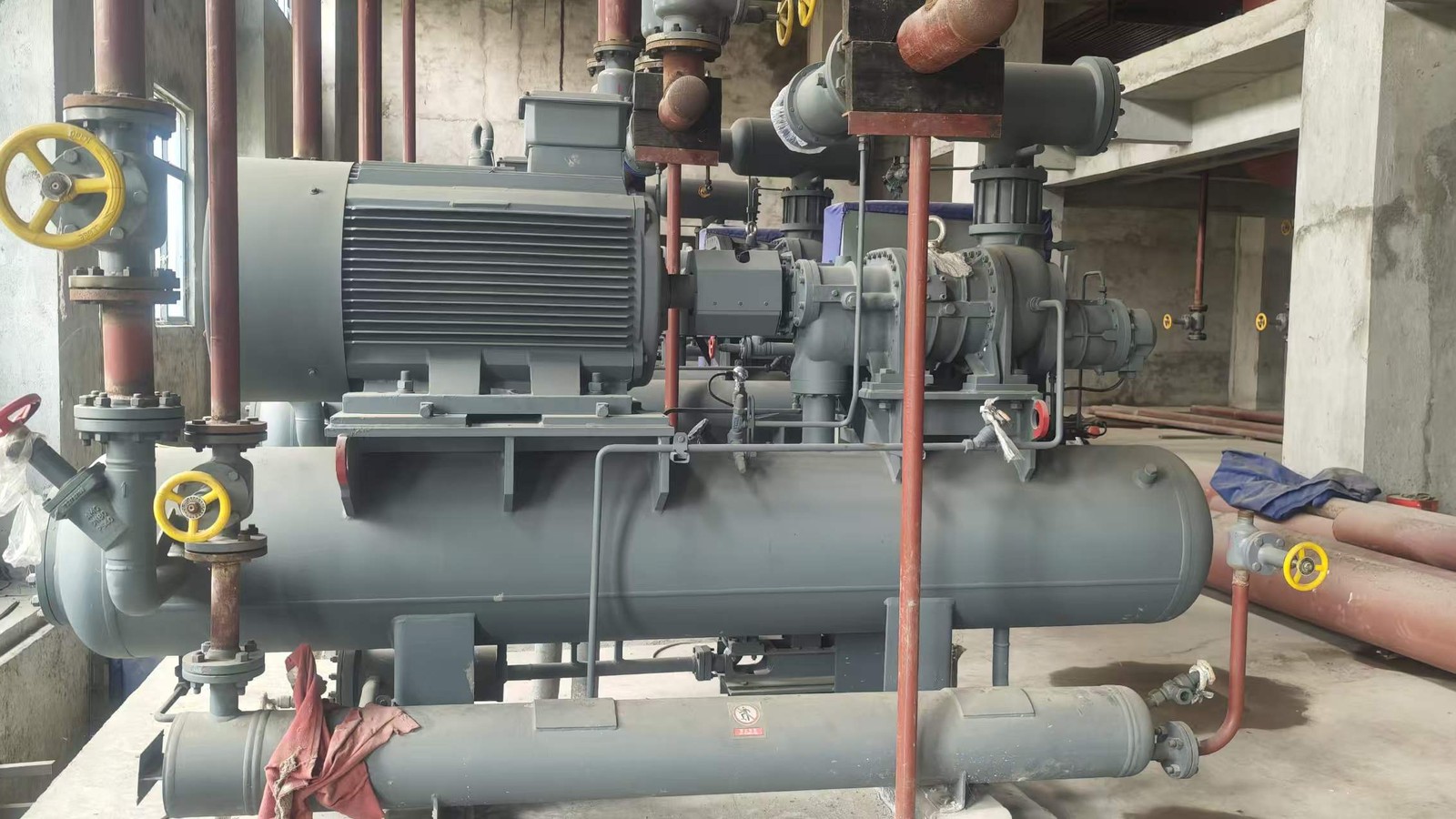 Water cooled industrial chiller unit installed in a plant room