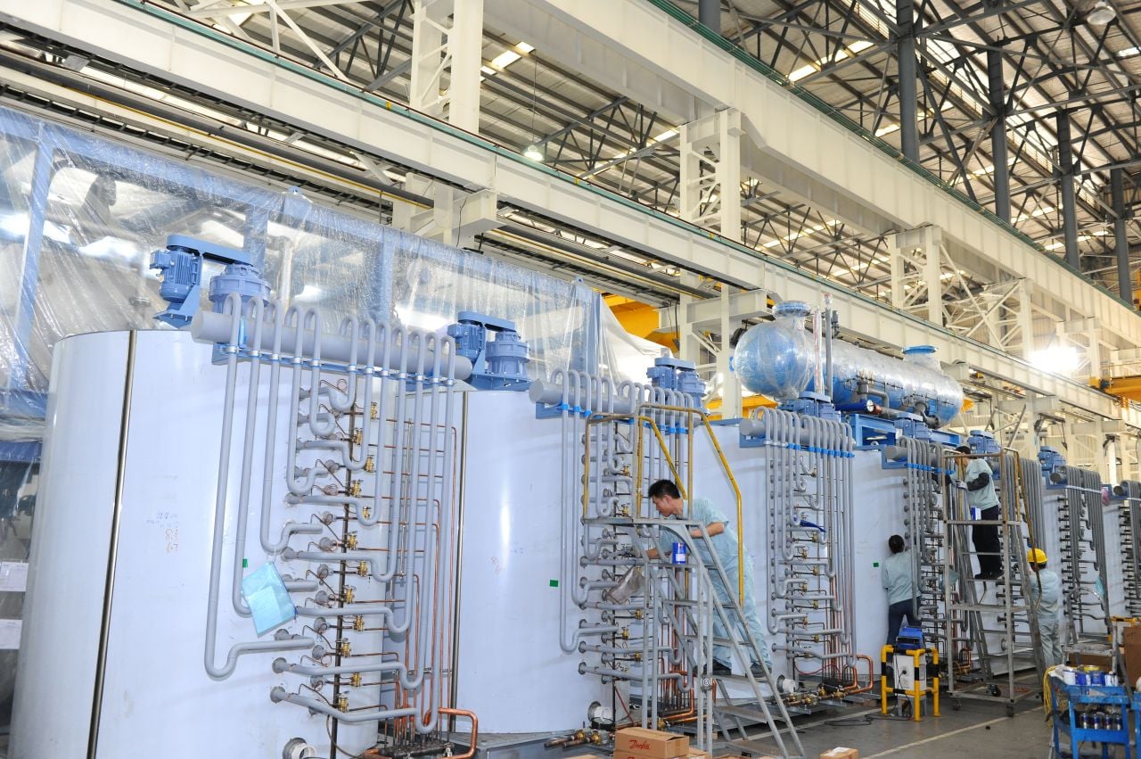 Industrial flake ice evaporator drums assembled in a manufacturing plant