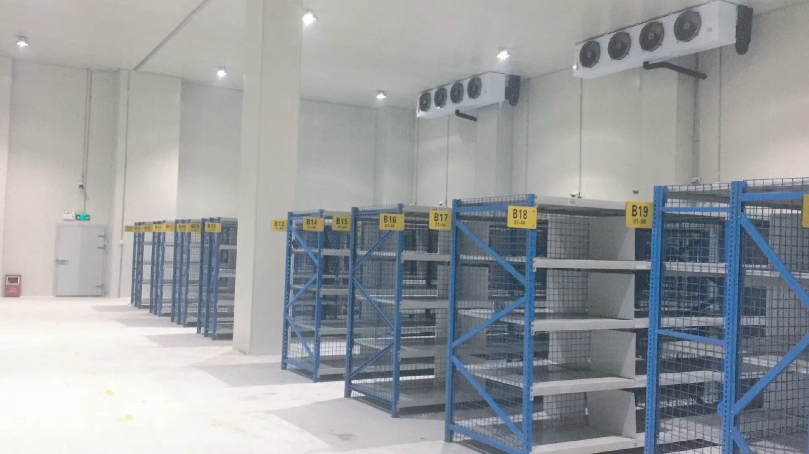 Cold storage room with refrigeration equipment and storage racks